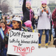 Angela Peoples holding sign (Kevin Banatte)